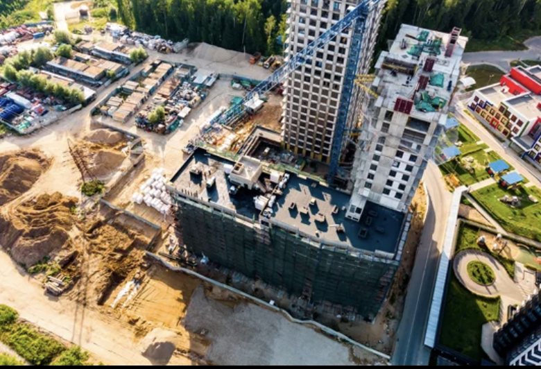 Aerial view of concrete towers under construction