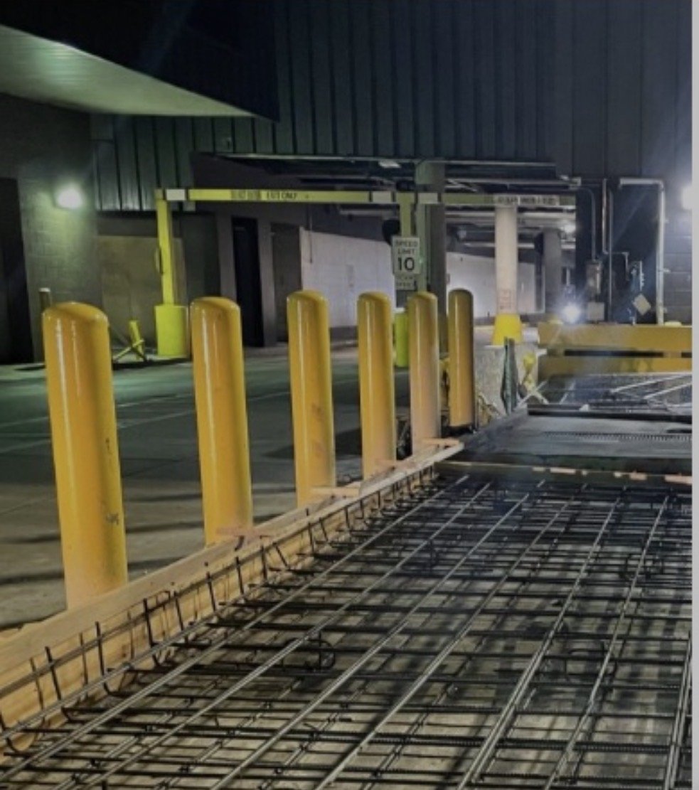 Slab reinforcement prepared for a night concrete pour at the Atlanta airport