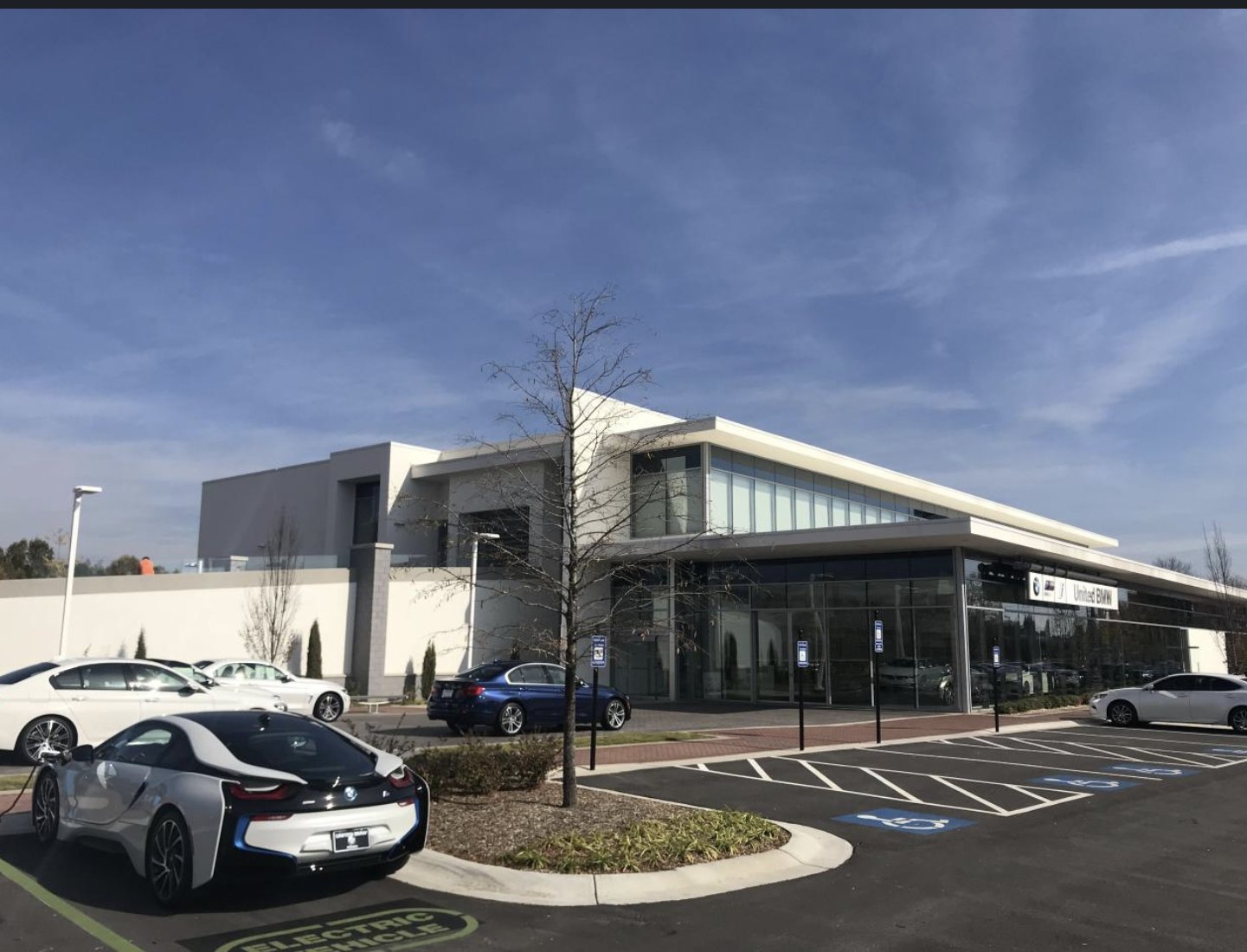United BMW dealership building with glass showroom